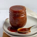 salted caramel sauce filled jar and spoon