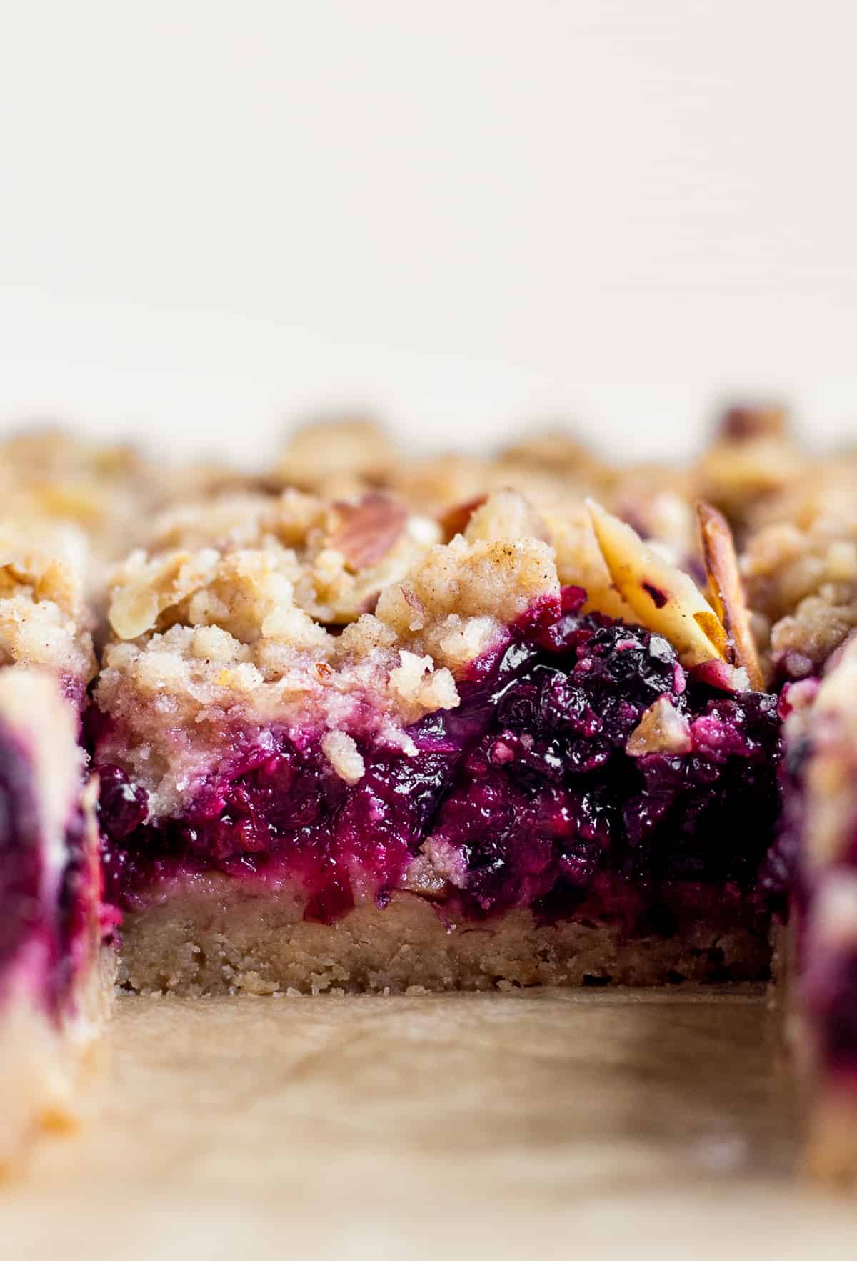 layers of the blackberry pie bars - crust, filling and crumble topping