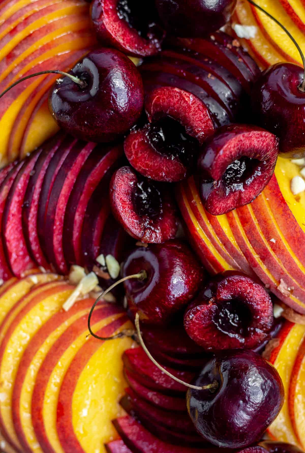 close up of sliced fruit on tart