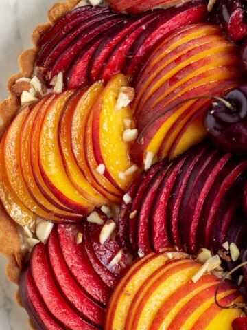 close up of tart with sliced fruit