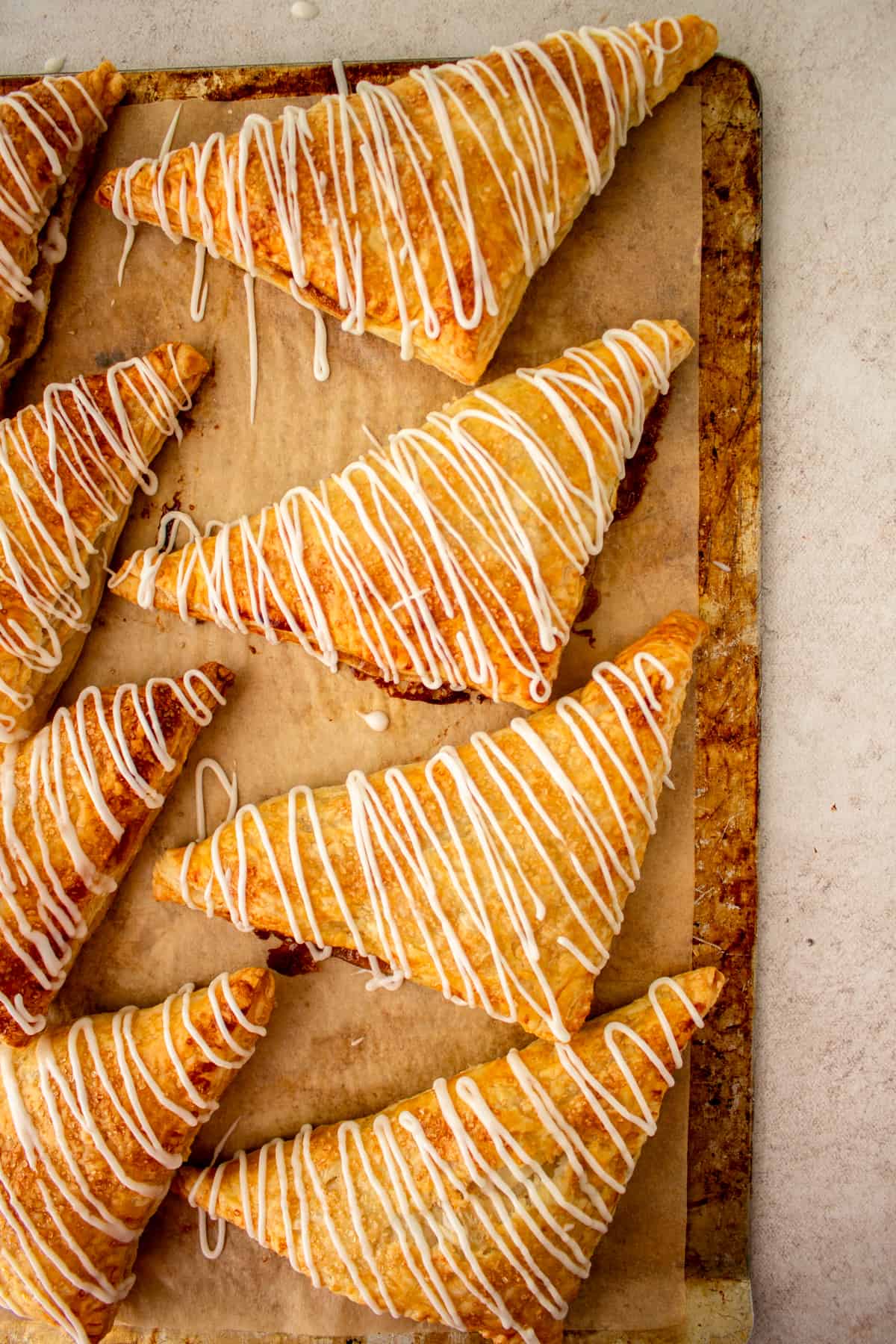 Iced turnovers on a cookie sheet