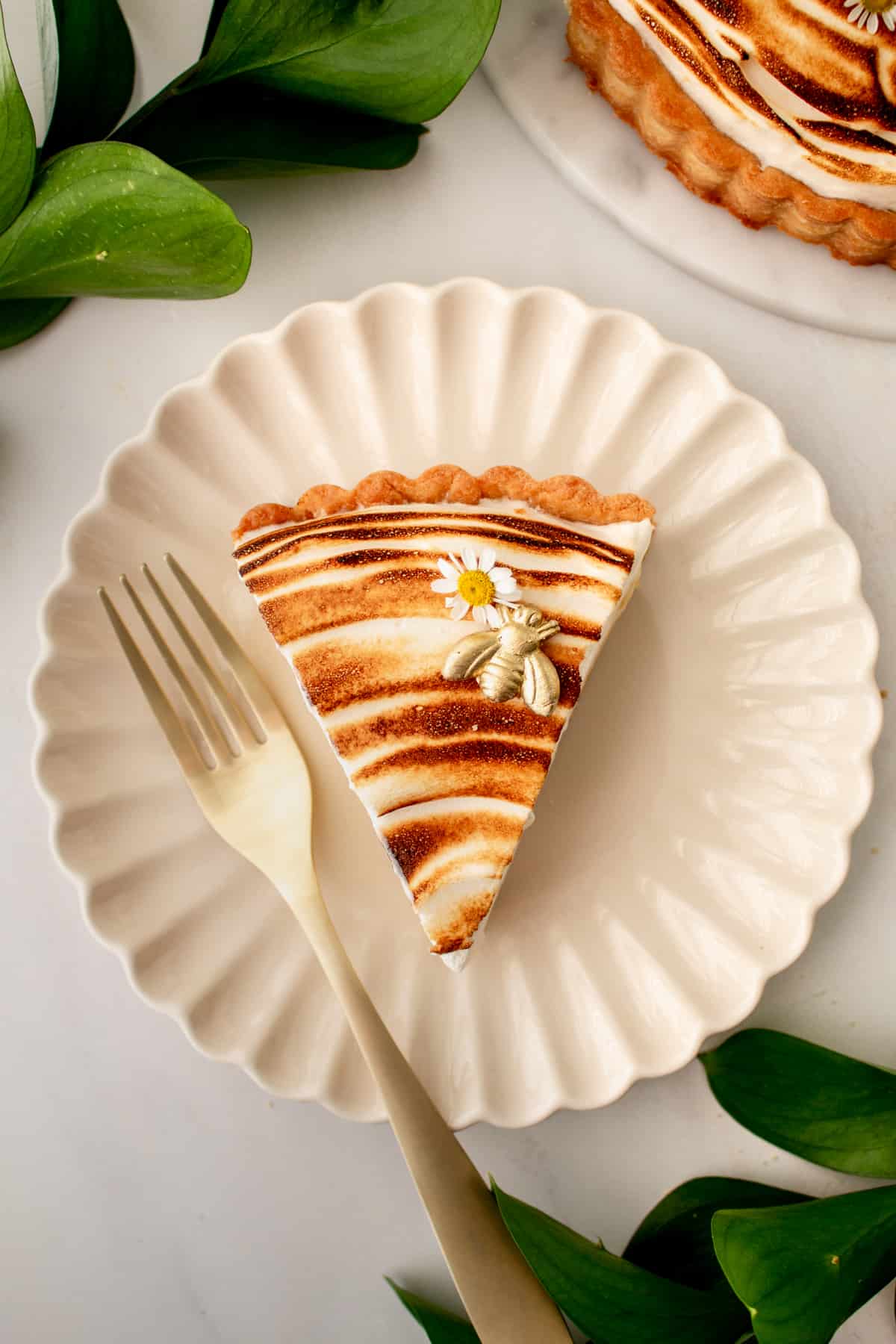 slice of tart on a plate with a fork